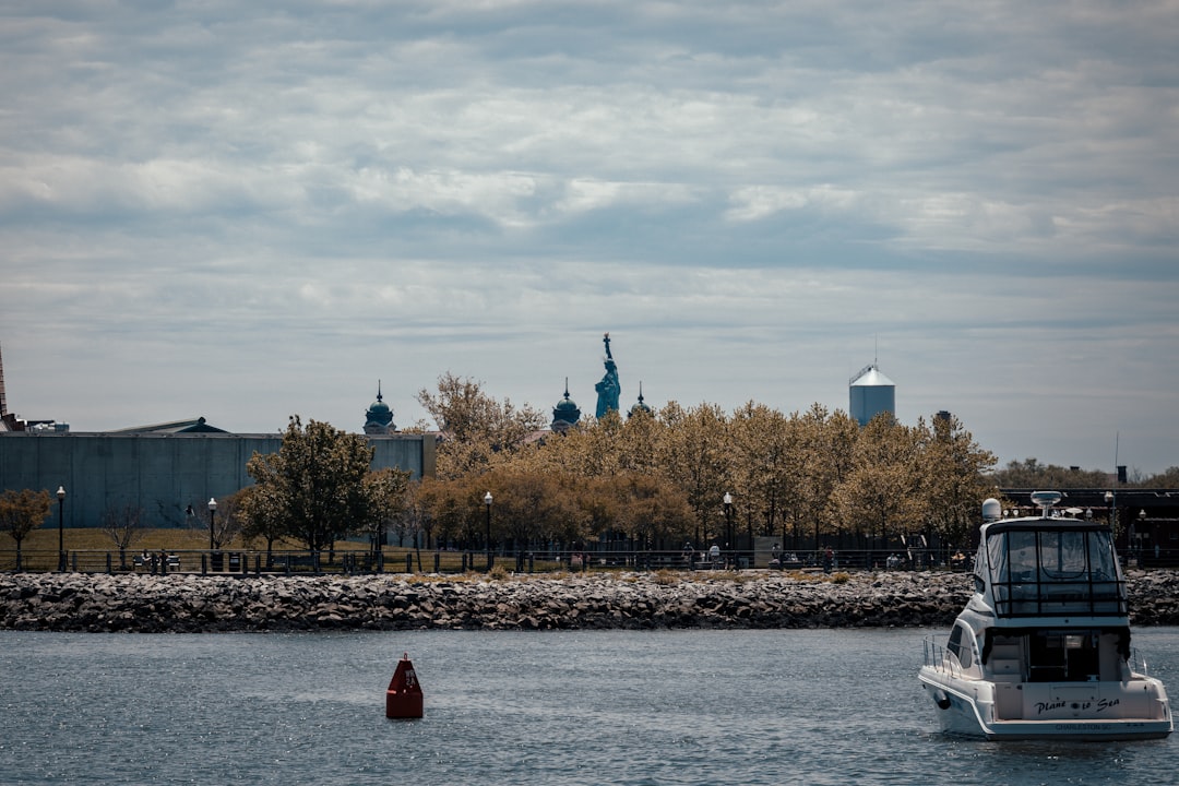 white boat on sea dock during daytime