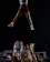 A cheerleader performing a stunt during a competition.