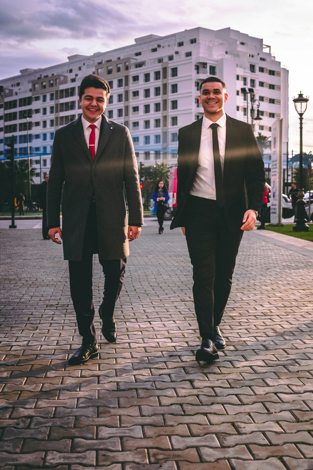 man in black suit standing beside man in black suit