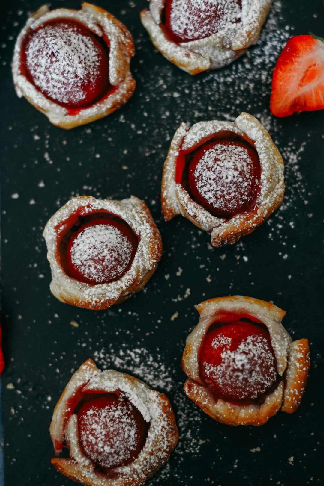 brown and white pastry on black surface