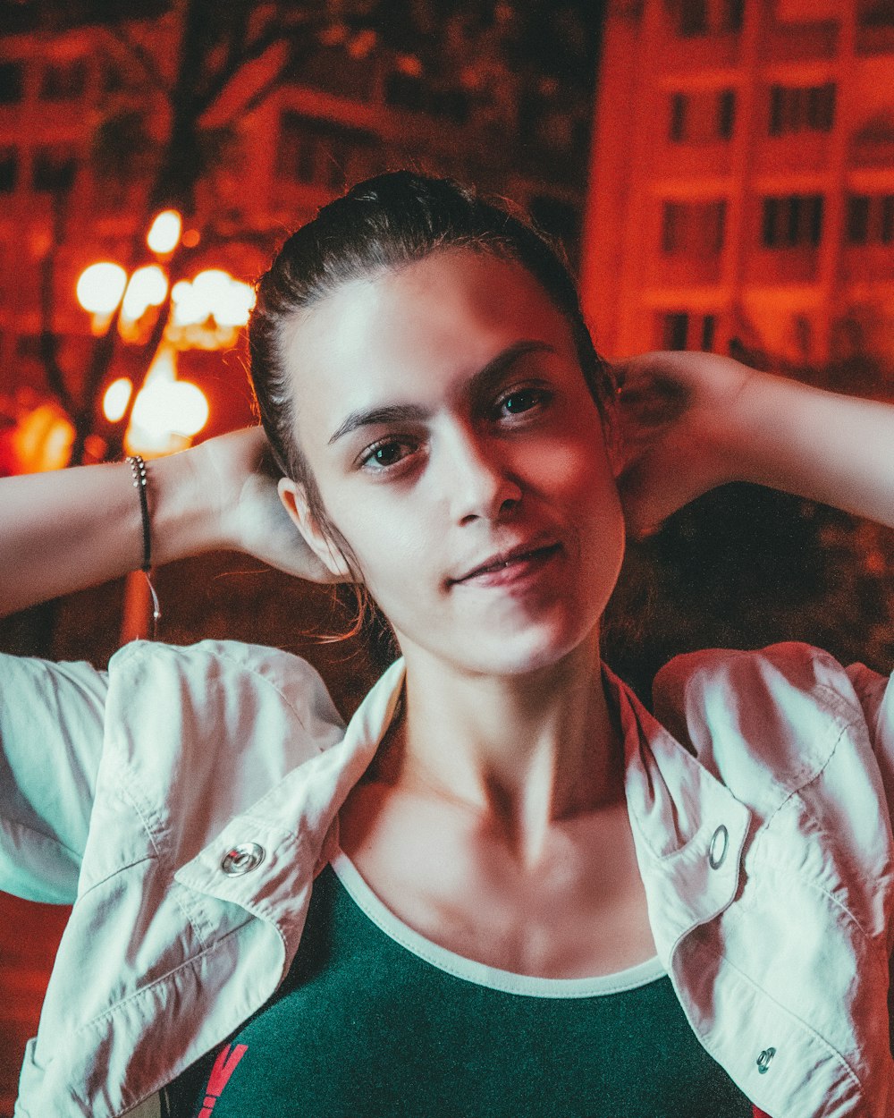 woman in white and green shirt