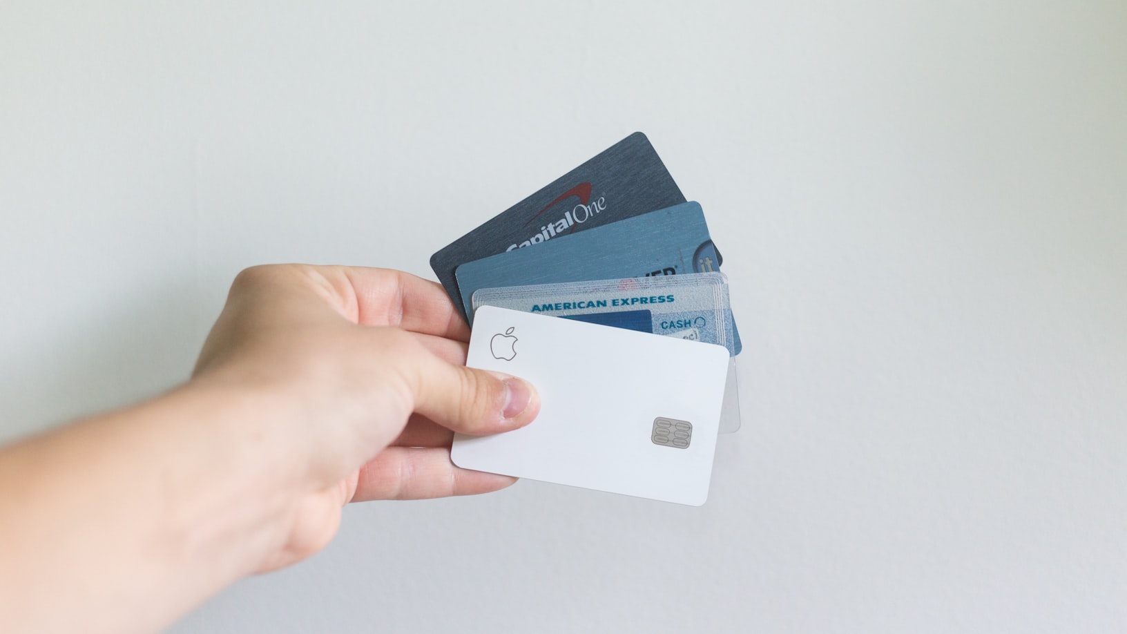 a person holding credit cards