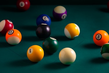 billiard balls on billiard table