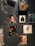 A wall decorated with various framed album covers and autographed photographs. There is a dark wall partially covered with images of musicians and singers. Some frames contain vintage album artworks while others feature black and white portraits with handwritten notes.