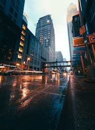people walking on sidewalk near high rise buildings during daytime