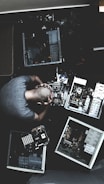man in blue shirt using computer