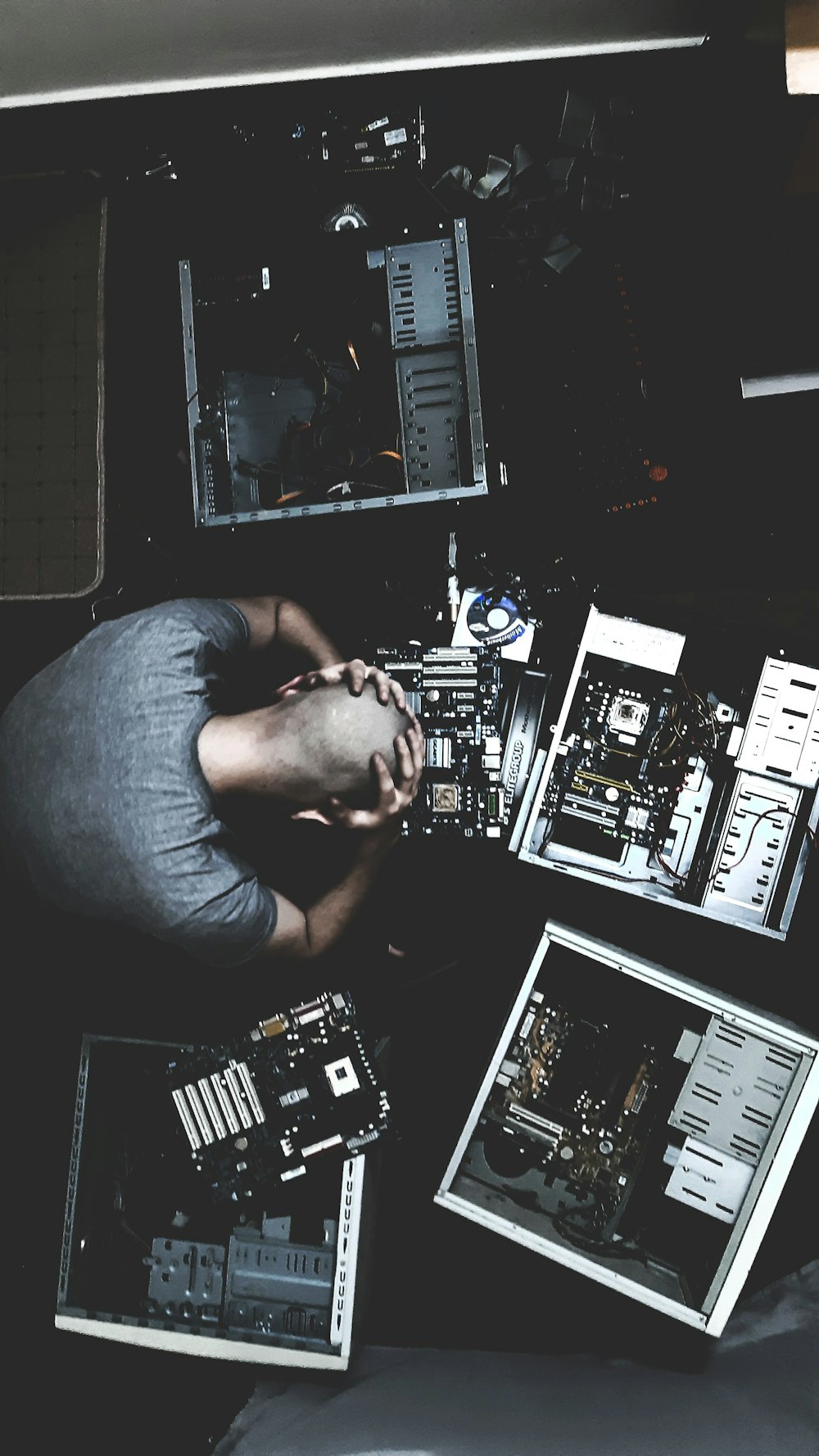 man in blue shirt using computer