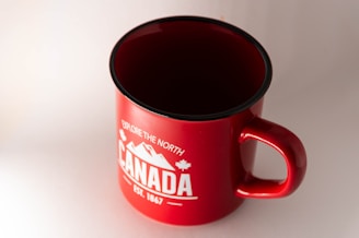 red and white ceramic mug