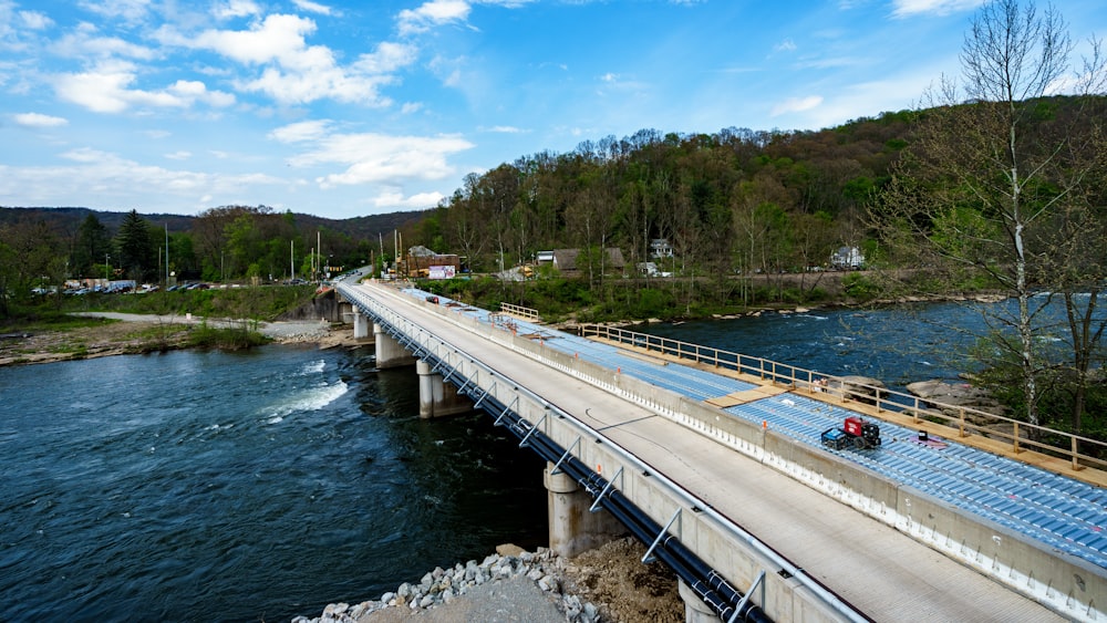 gray concrete bridge over river