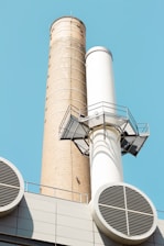 white concrete tower under blue sky during daytime