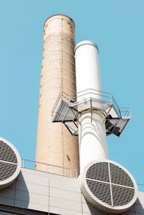white concrete tower under blue sky during daytime