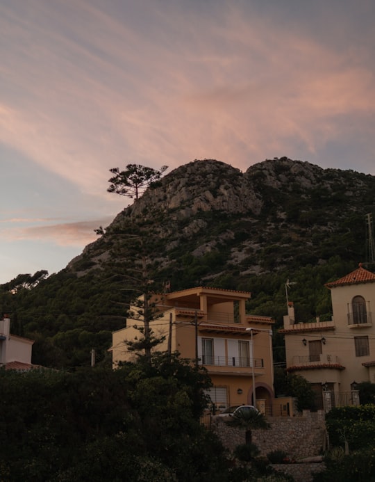 white and brown concrete building on top of mountain in Garraf Spain