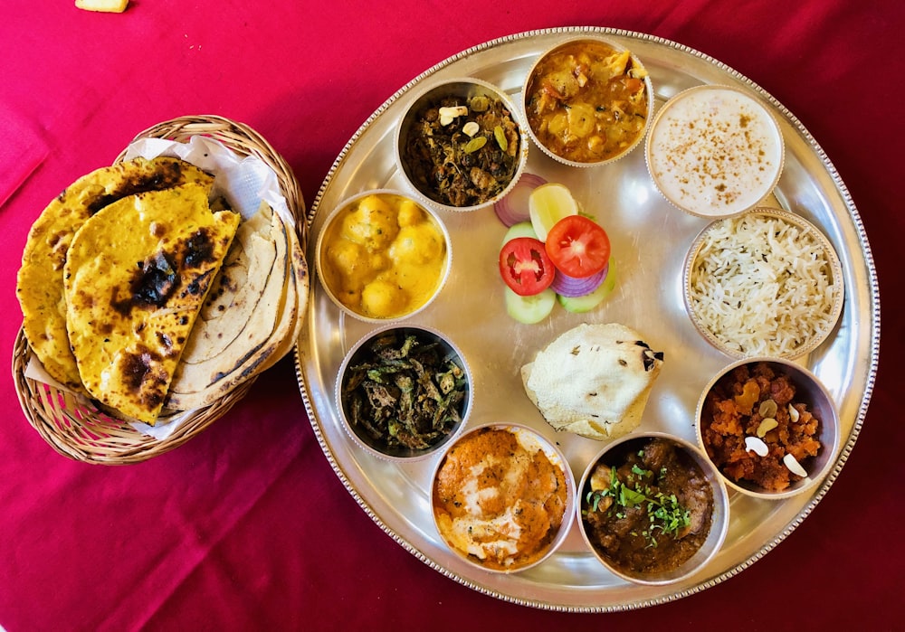 assorted foods on stainless steel tray