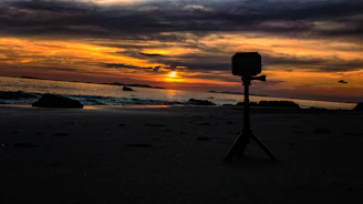 A vibrant photo of a travel influencer capturing a sunset over a tropical beach.