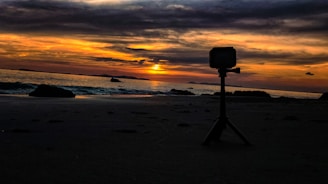 A vibrant photo of a travel influencer capturing a sunset on a tropical beach.