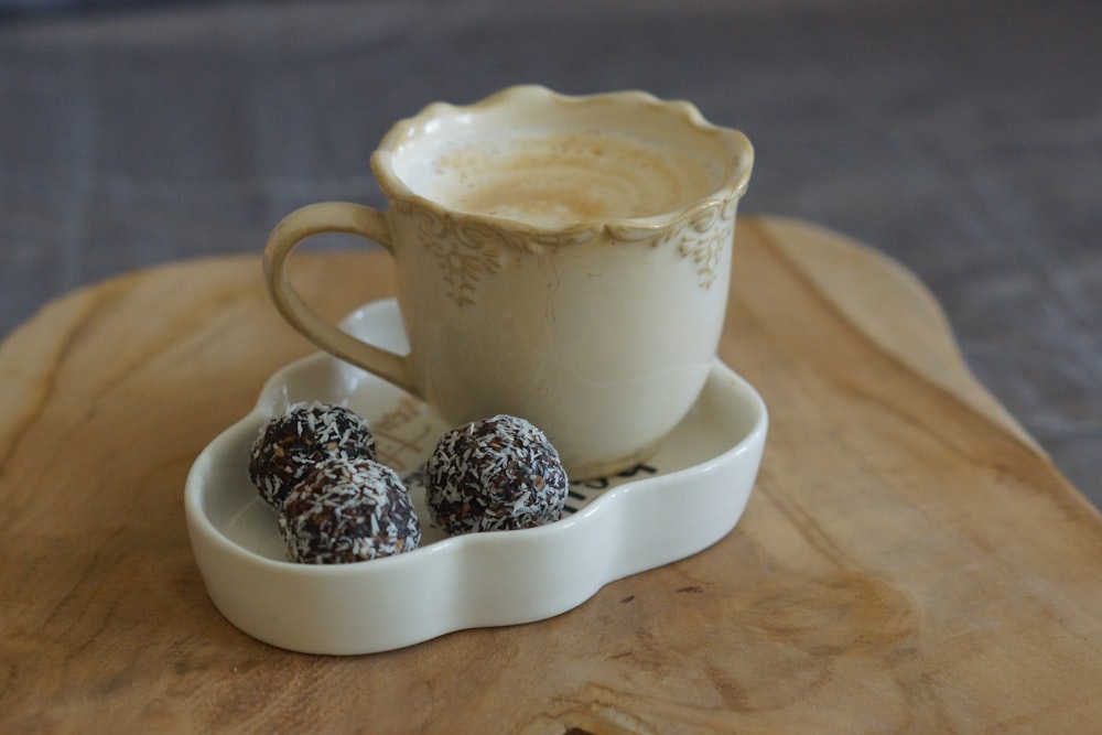 white ceramic cup with brown liquid