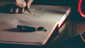 Close-up of a hand writing poetry in a beautifully designed Versalume notebook under soft natural light.