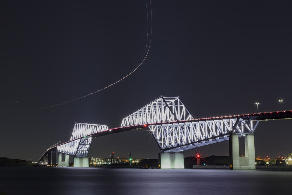 white bridge with lights during night time