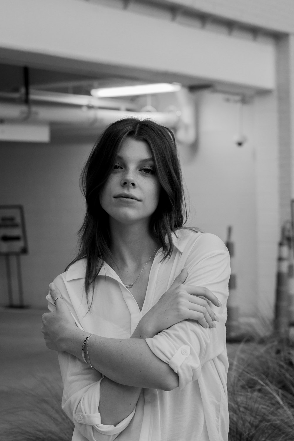 grayscale photo of woman in white dress shirt