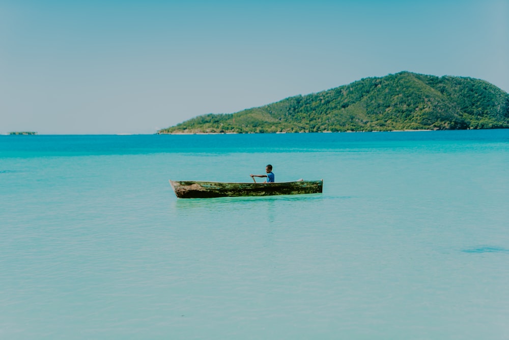 brown wooden dock on body of water during daytime