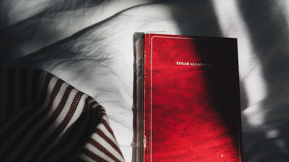 red book on white textile