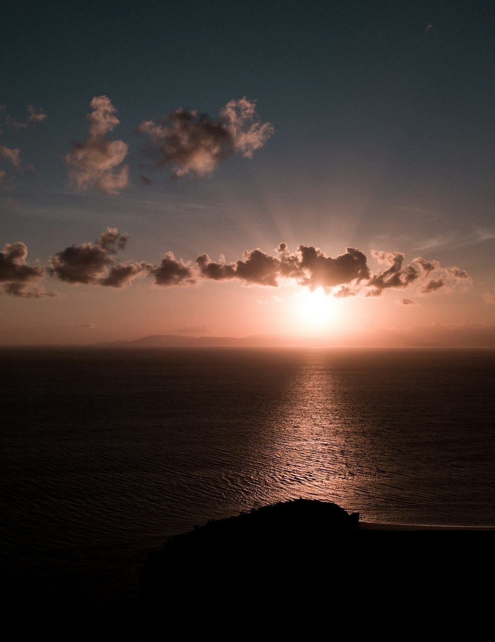 silhouette of mountain during sunset