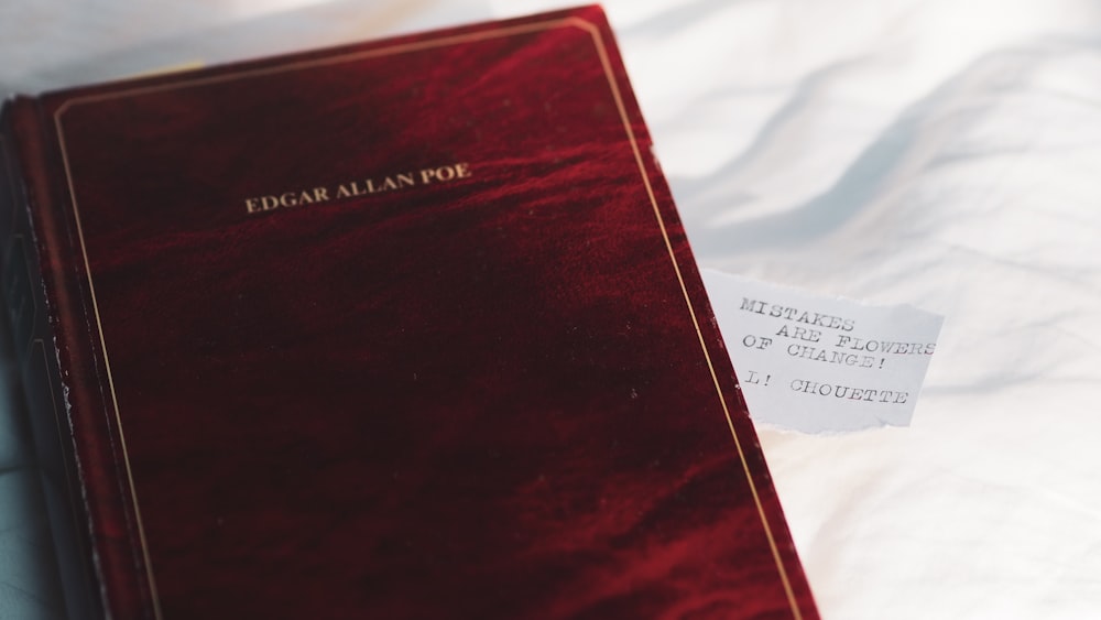 red book on white textile