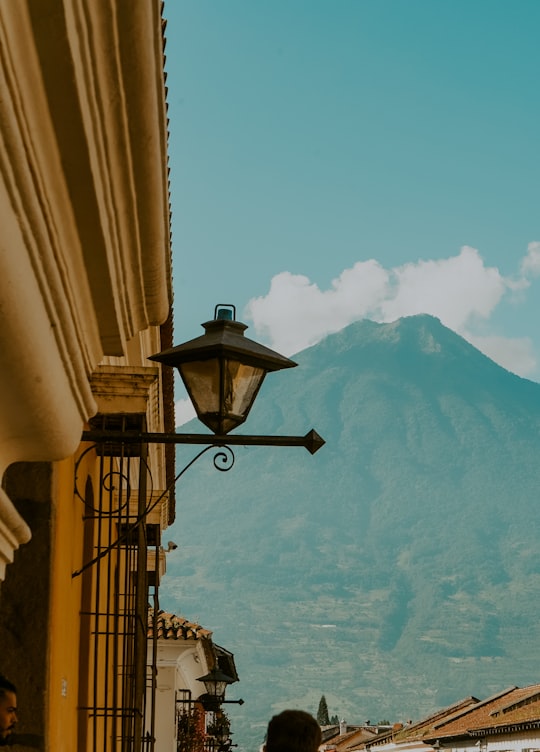 black sconce lamp on brown wooden railings in Antigua Guatemala Guatemala