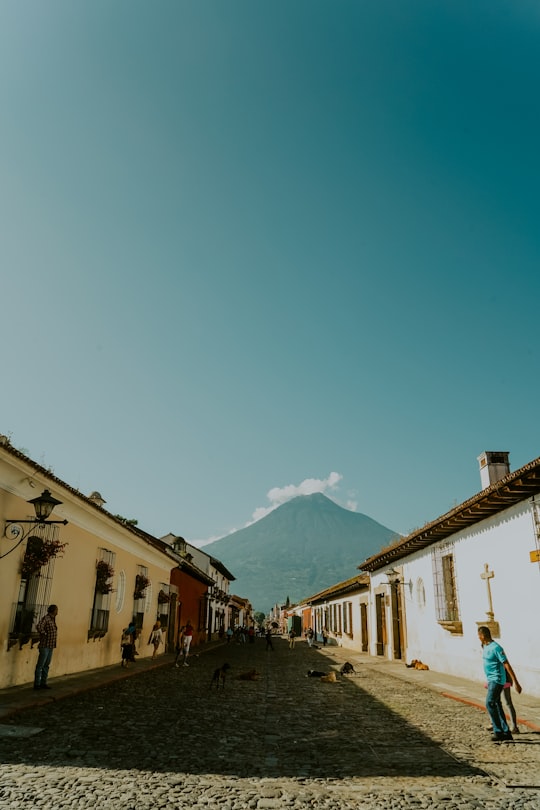 people walking on street near buildings during daytime in Antigua Guatemala Guatemala