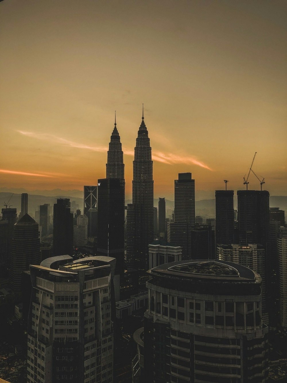 high rise buildings during sunset