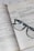 An open book with mathematical formulas and graphs is accompanied by a pair of black-rimmed glasses resting on the pages.