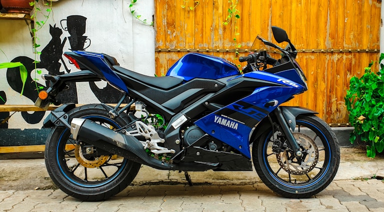 A sleek, modern Yamaha motorcycle showroom with red, blue, and white accents reflecting the brand colors.