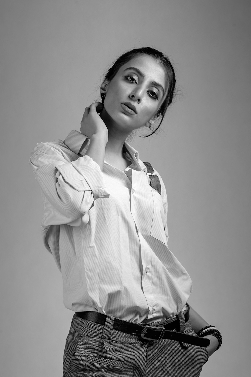 grayscale photo of woman in white button up shirt