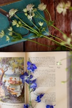 blue flowers on white book page