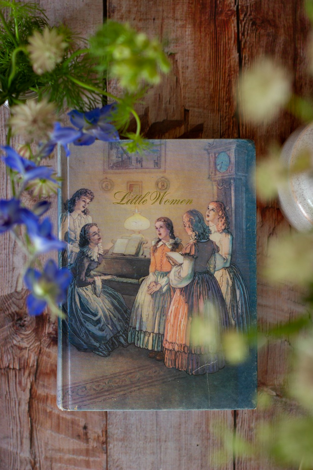 blue and white flowers in clear glass vase