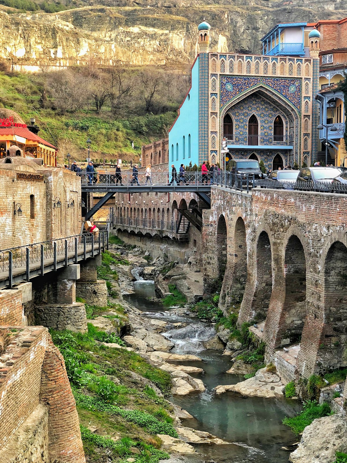 Sololaki Tbilisi — the historic neighbourhood below Narikala Fortress with ornate balconied buildings and the gorge below