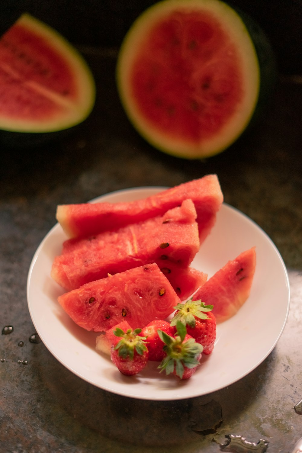 sliced watermelon on white ceramic plate