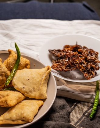 a plate of food and a bowl of food on a table