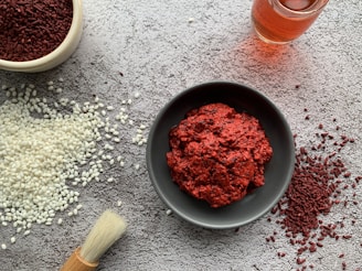 Close-up of rich, textured miso paste in a rustic ceramic bowl with subtle shadows.