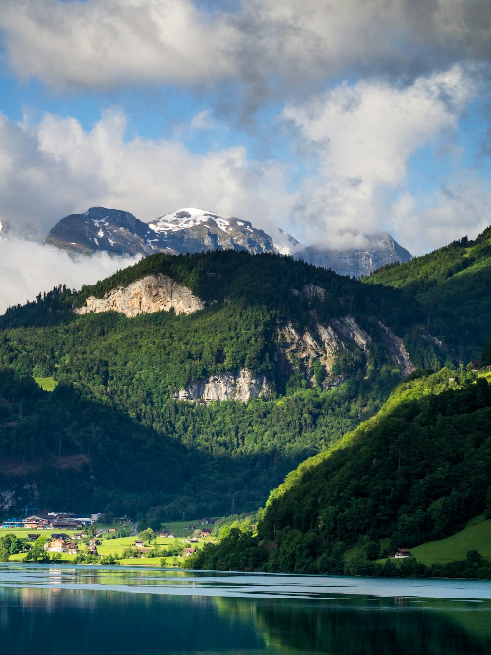 green mountains under white clouds during daytime