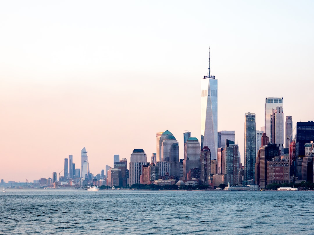 city skyline across body of water during daytime