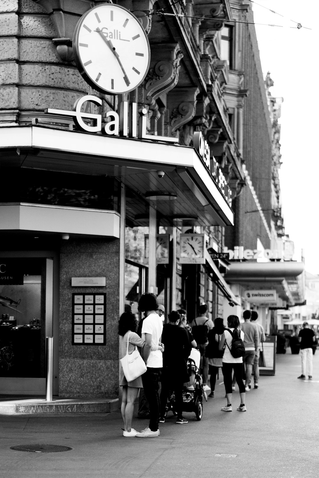 grayscale photo of people walking on street