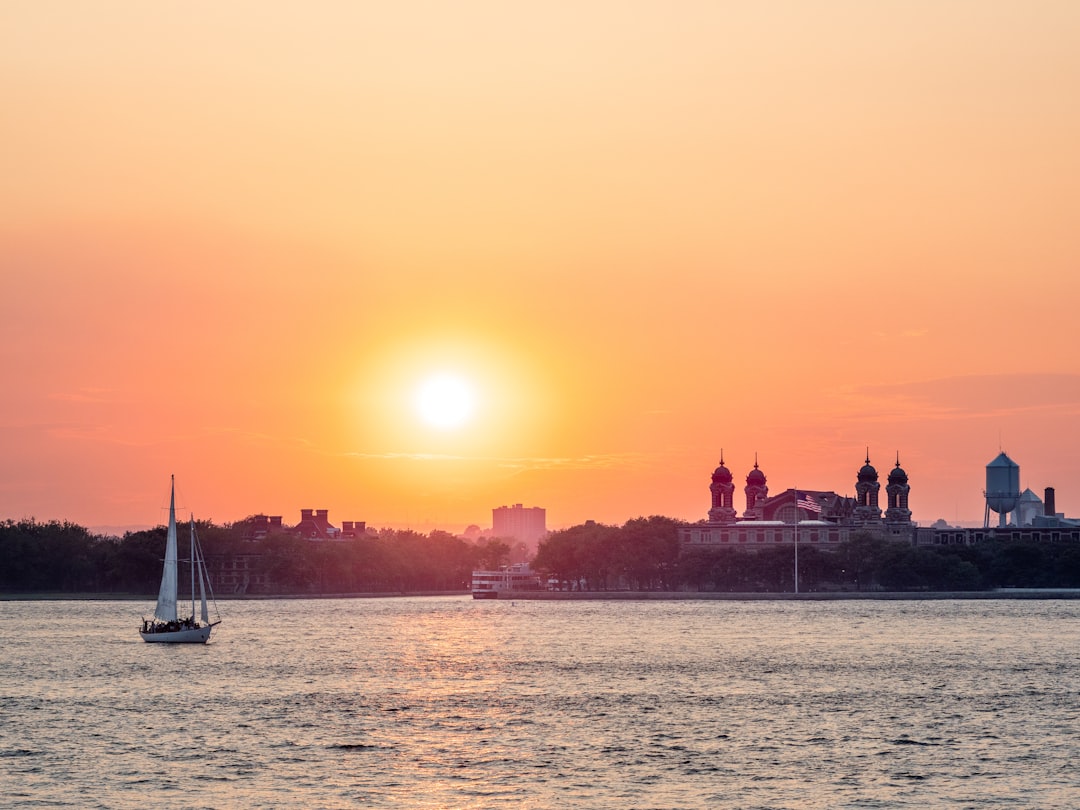 silhouette of people on boat during sunset