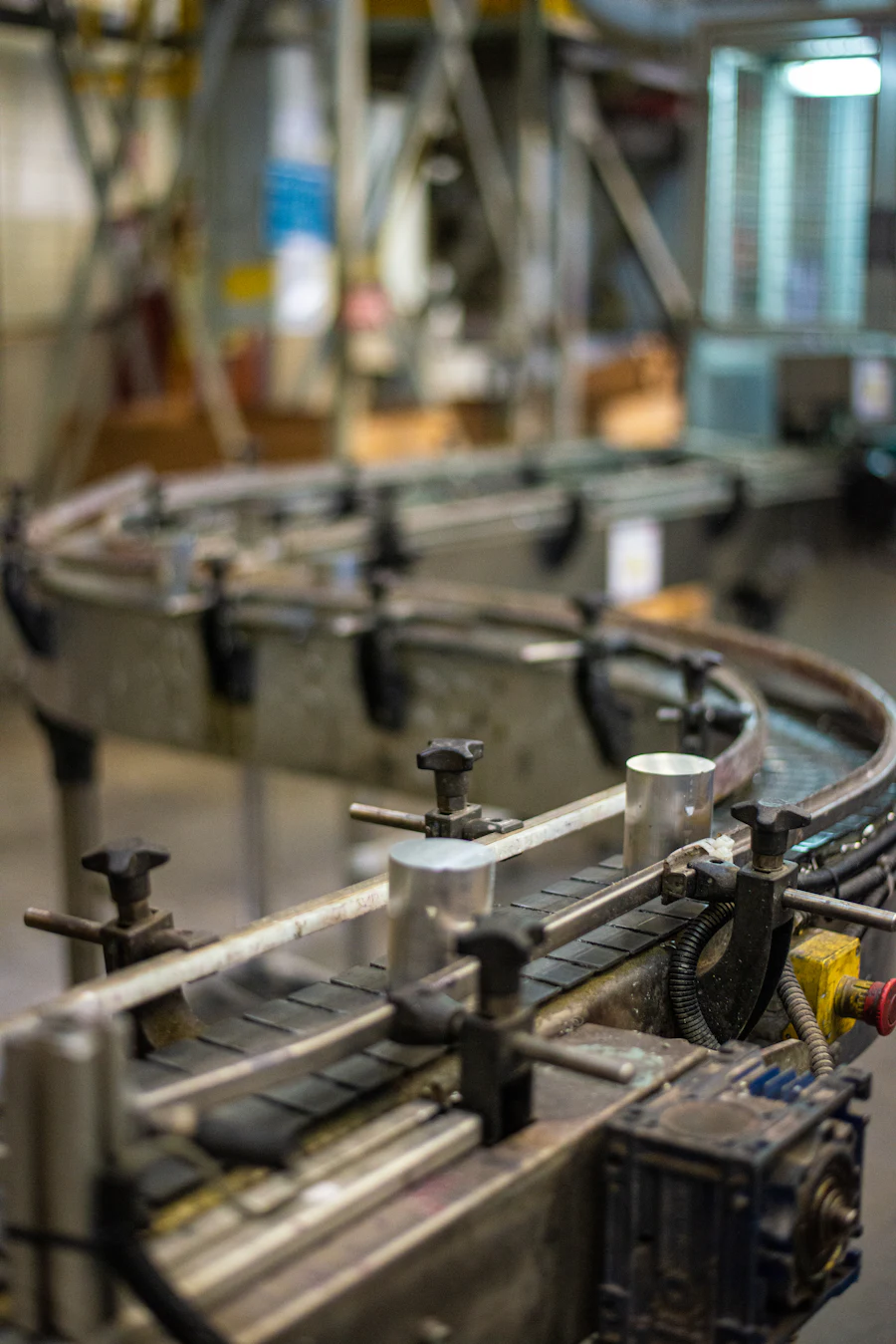 Stainless steel conveyor and press line inside the production hall