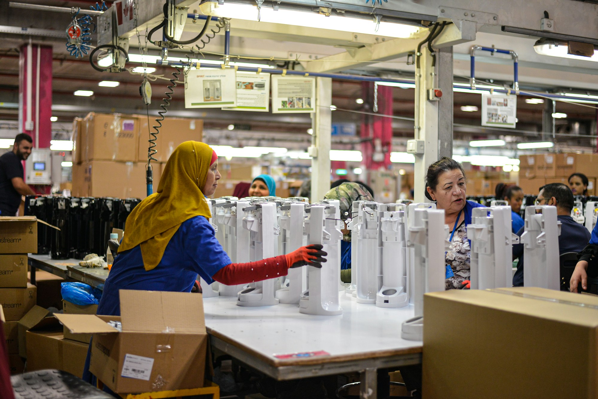 Women working on SodaSteam devices at the SodaStream factory in Israel. Shot during press trip to SodaStream factory in 2019.
