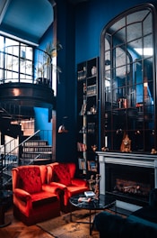 A cozy living room with deep navy walls and copper accents reflecting a warm, elegant atmosphere.