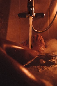 Warm ambient lighting from Jaquar decorative lights illuminating a contemporary bathroom.