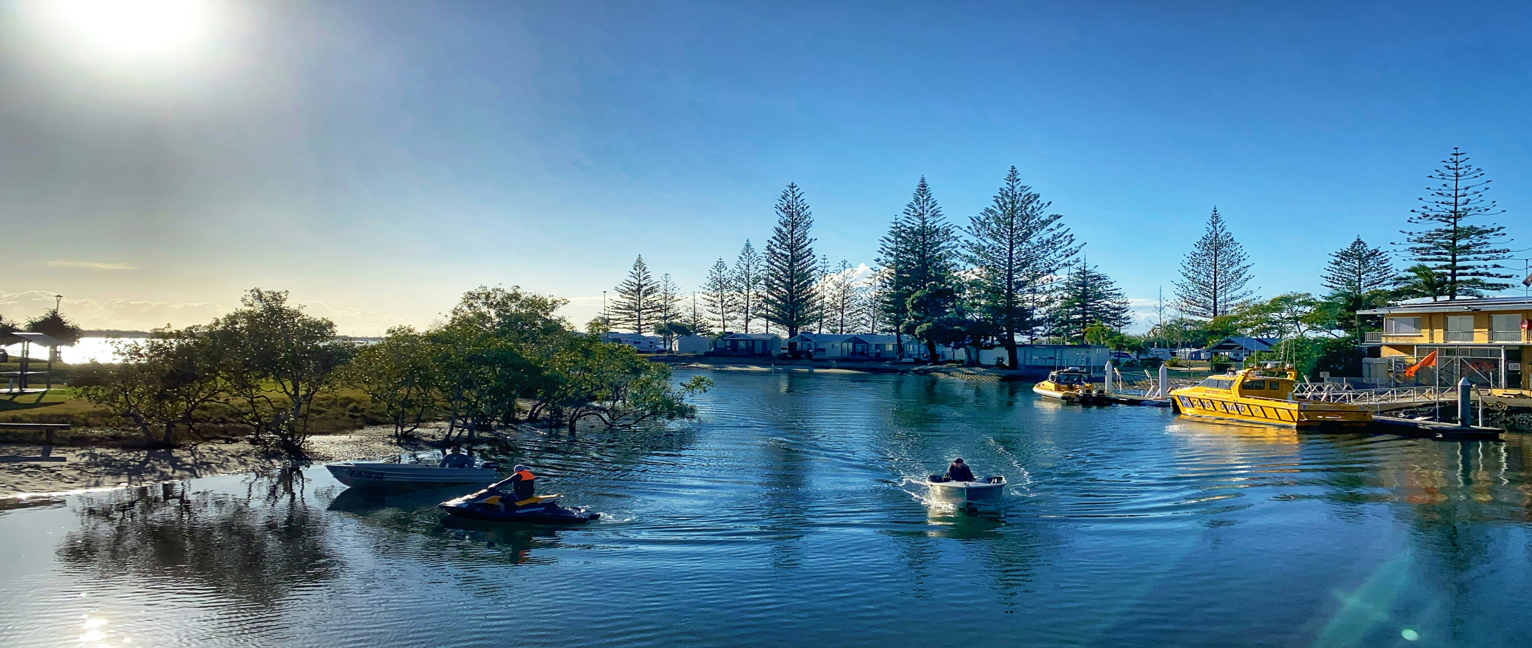 people riding on boat on river during daytime