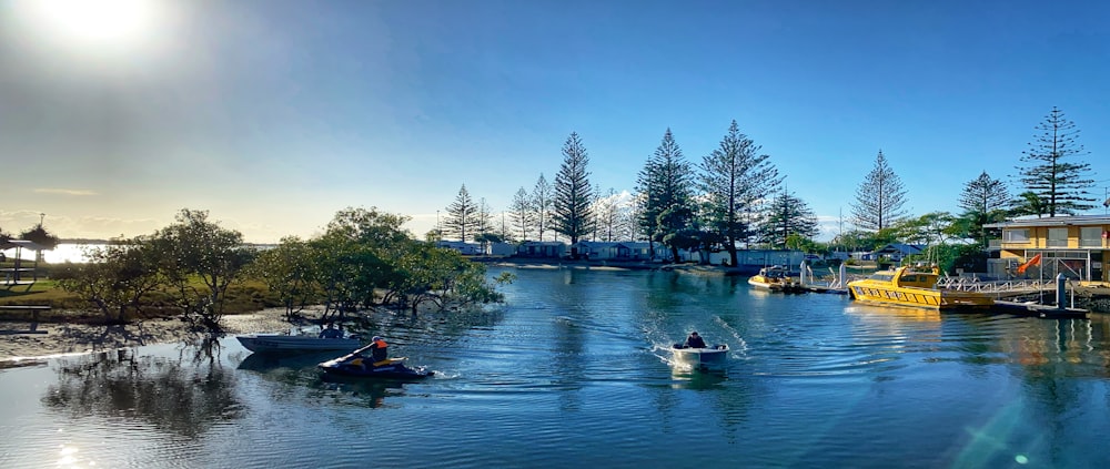 people riding on boat on river during daytime