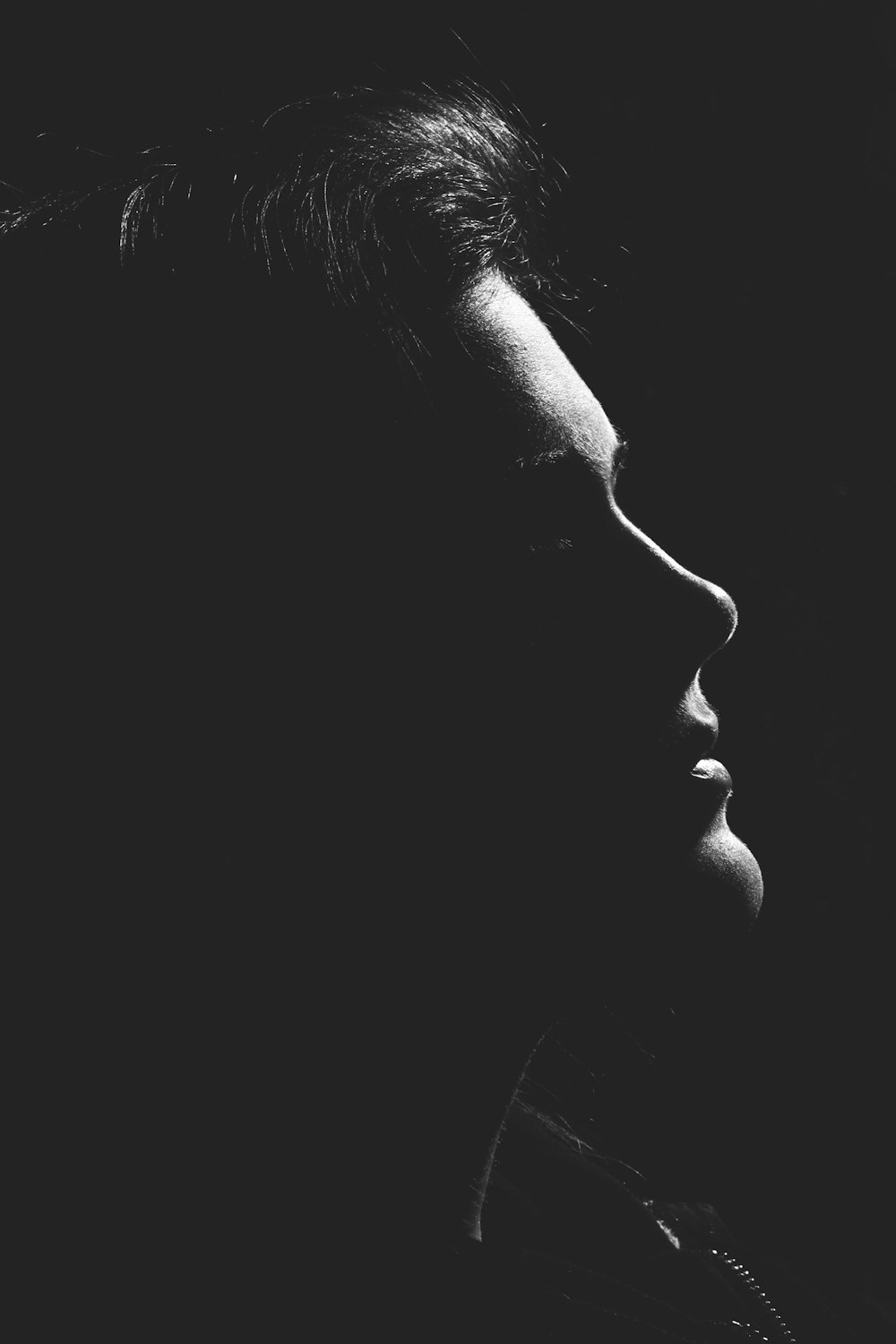 grayscale photo of womans face